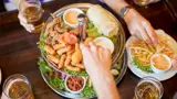 Aerial view of a table containing several plates of food