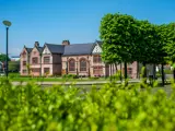 Exterior view of Ordsall Hall on a sunny day