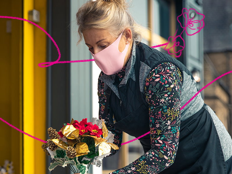 A florist holding some flowers
