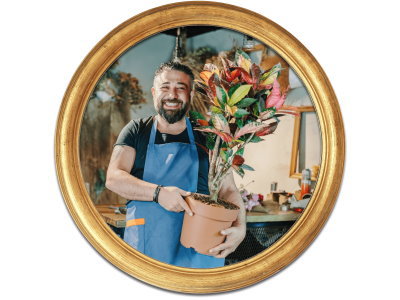 A man holding a plant