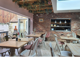 The inside of the Delph showing tables and chairs