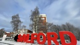 [Red Salford sign covered in snow] 