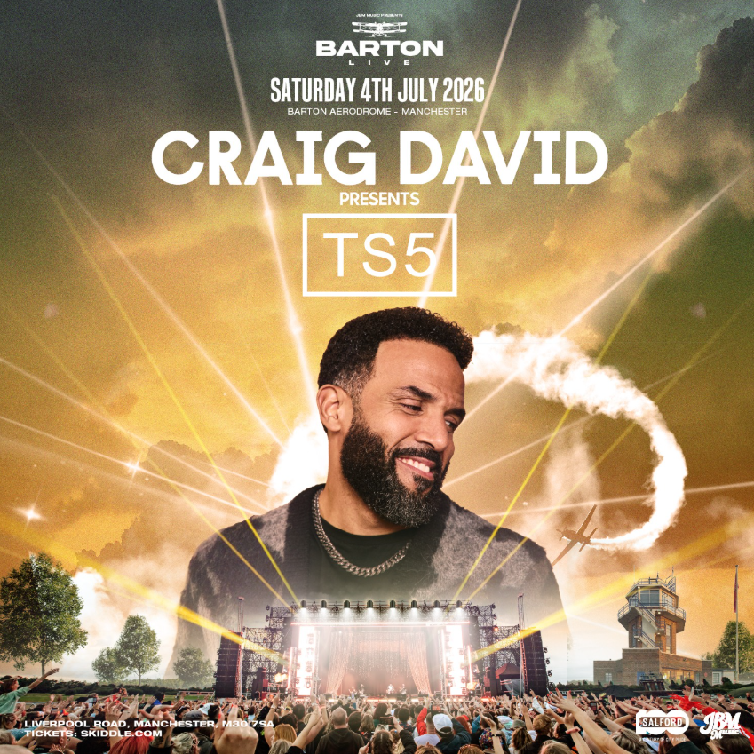 Concert poster featuring a large central figure against a dramatic sky with clouds and light beams. Text on the poster announces: ‘Barton Live – Saturday 4th July 2026 – Barton Aerodrome, Manchester. Craig David presents TS5.’ At the bottom, a large outdoor stage is shown with a cheering crowd, trees, and small aircraft imagery in the background.
